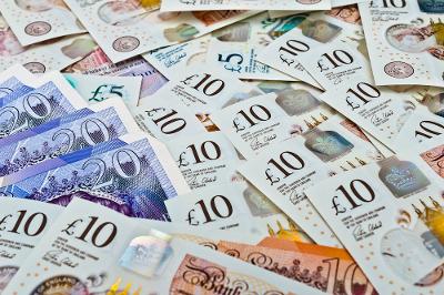 A pile of £5, £10 and £20 notes